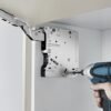 Kitchen Cabinet Television lift being installed