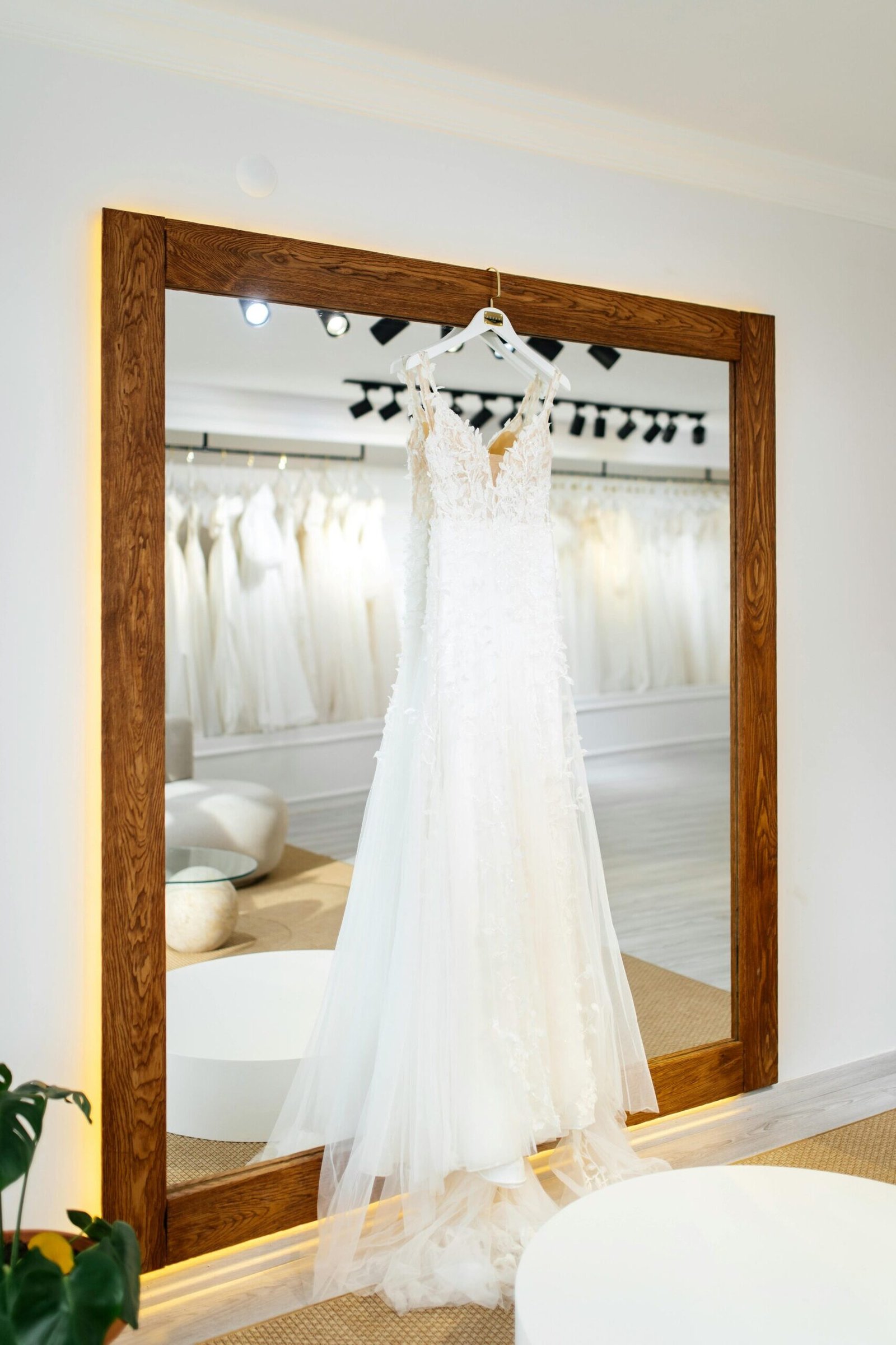 A framed wall-mirror in a bridal boutique, for a custom magic mirror tv